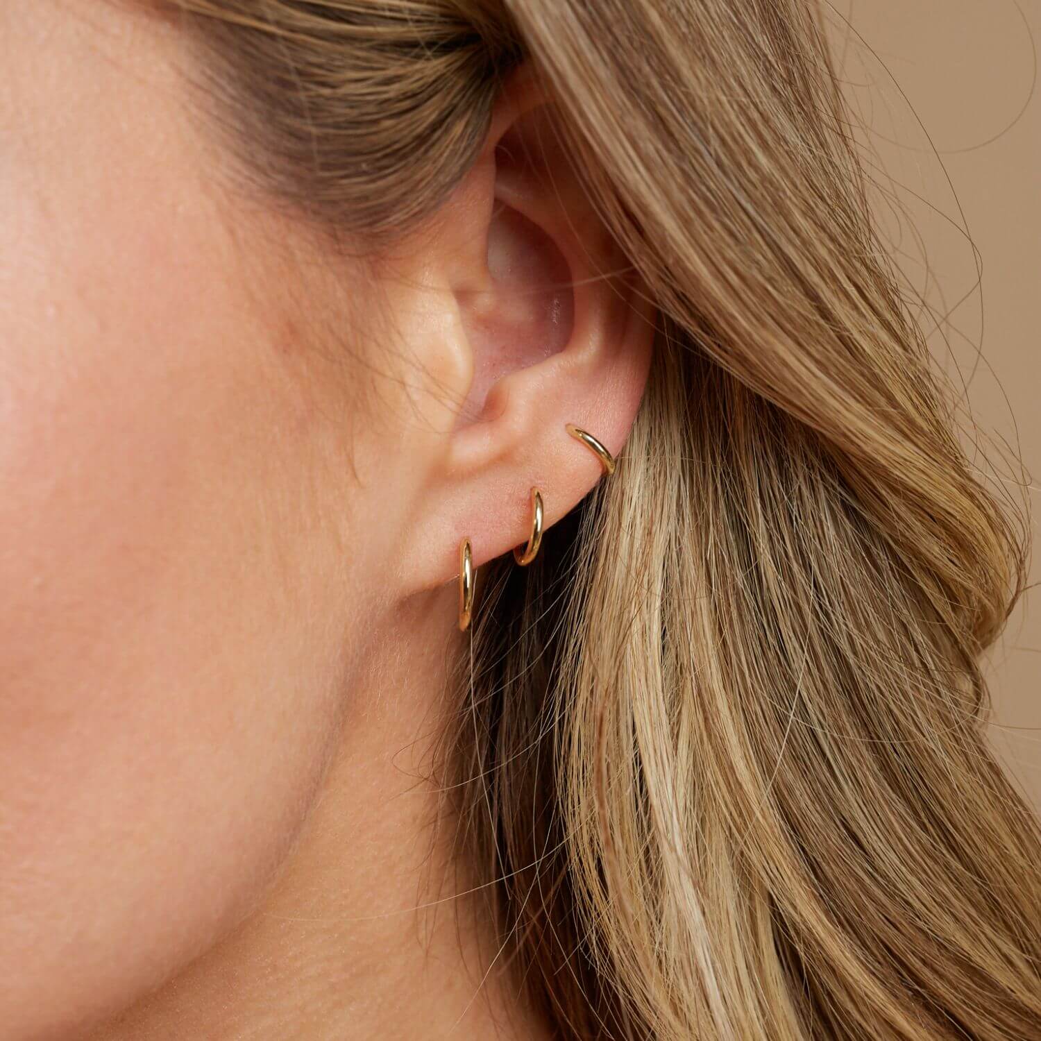 Grand Solid Huggie Hoop Earrings - Image 6
